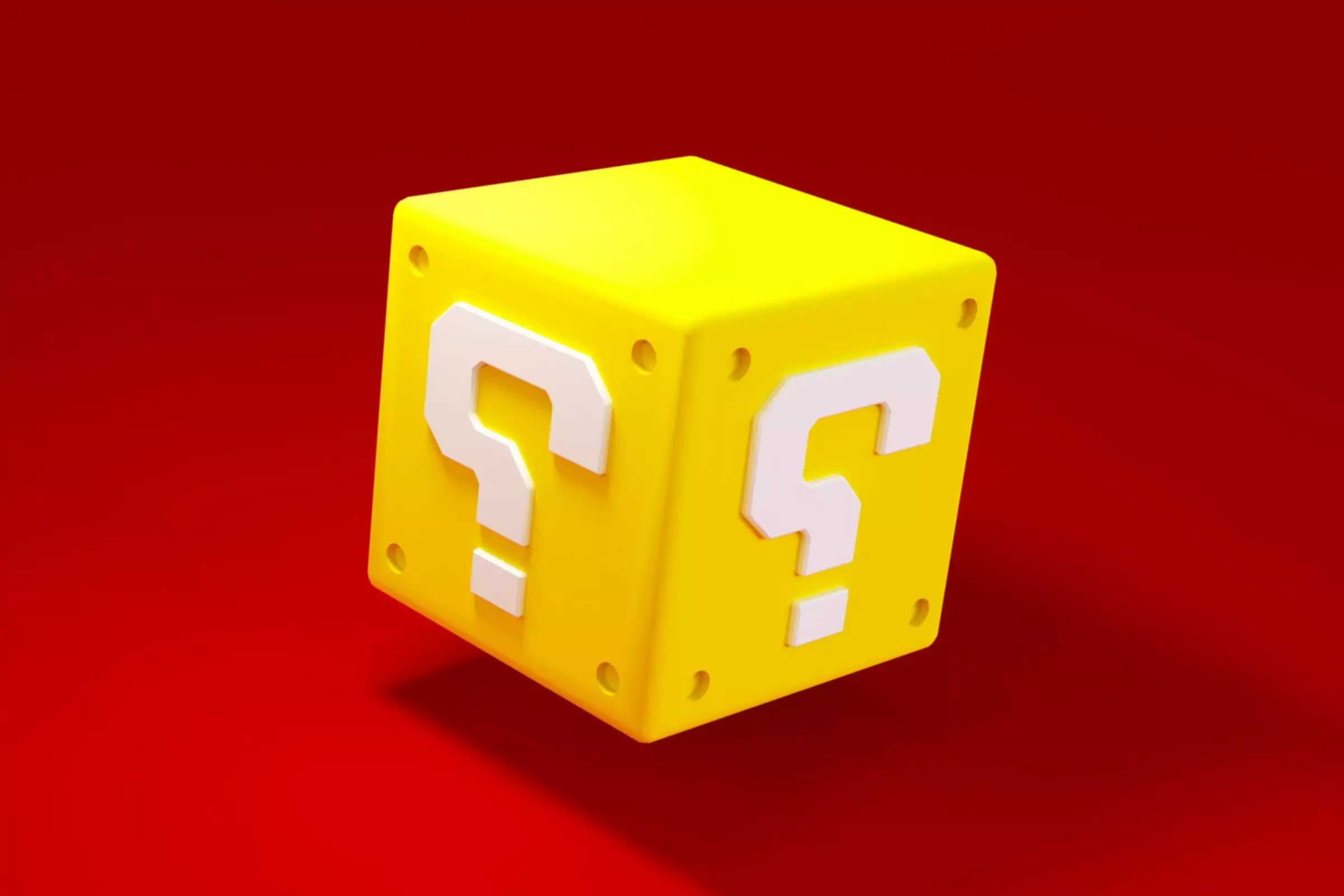 Cube doré avec point d'interrogation sur fond rouge