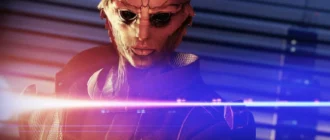 Snímek obrazovky ze hry Mass Effect s postavou v masce osvětlené modrými a oranžovými světly