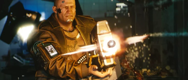 Capture d'écran du jeu Cyberpunk 2077 montrant un personnage tirant avec une grosse mitrailleuse.
